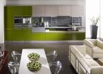 A striking two tone kitchen mixing grey and green. Note the functional level for storage below the cooktop.